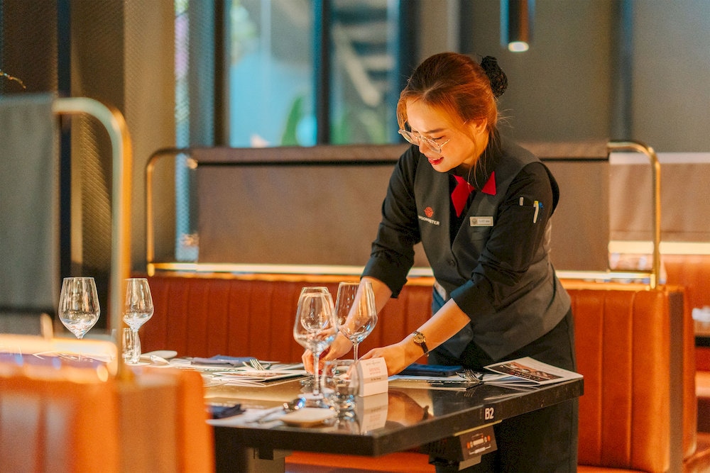 WOOMASTER offers a Korean BBQ experience with modern decor and a unique steak aging method